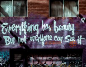 Graffiti that reads "Everything has beauty but not everyone can see it"